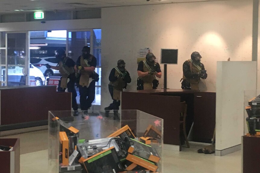 Police with face masks and guns
