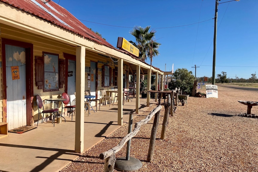 picture of a pub in very small town with front verandah and hitching rails