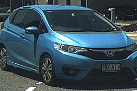 A blue Honda Jazz