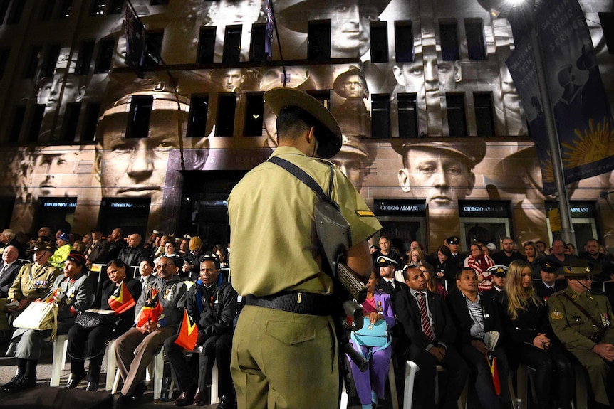 Member of catafalque party stands guard during Anzac Day dawn service
