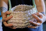 Aly de Groot holds a basket made with ghost net