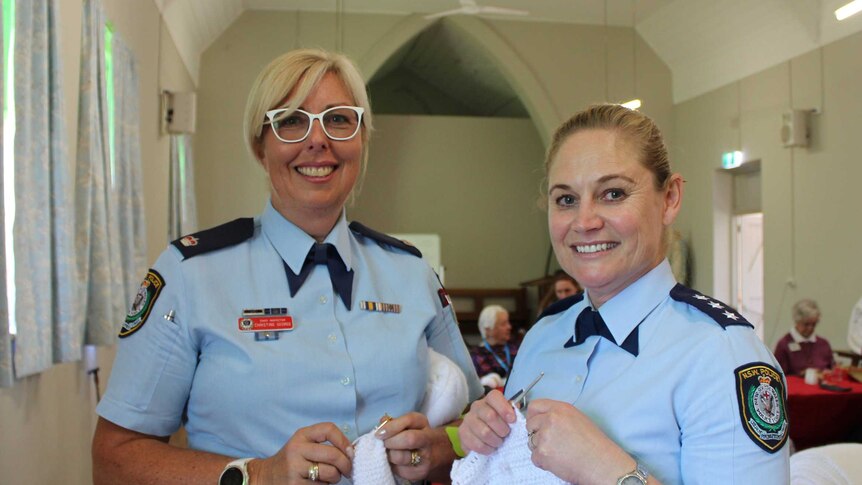 Chief Inspector Christine George and Detective Sergeant Natalie Antaw knitting