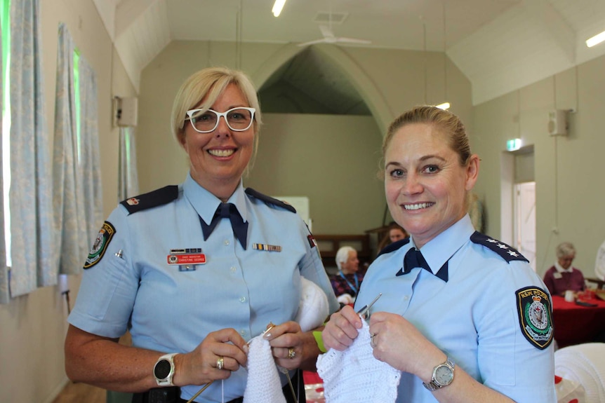 Chief Inspector Christine George and Detective Sergeant Natalie Antaw knitting