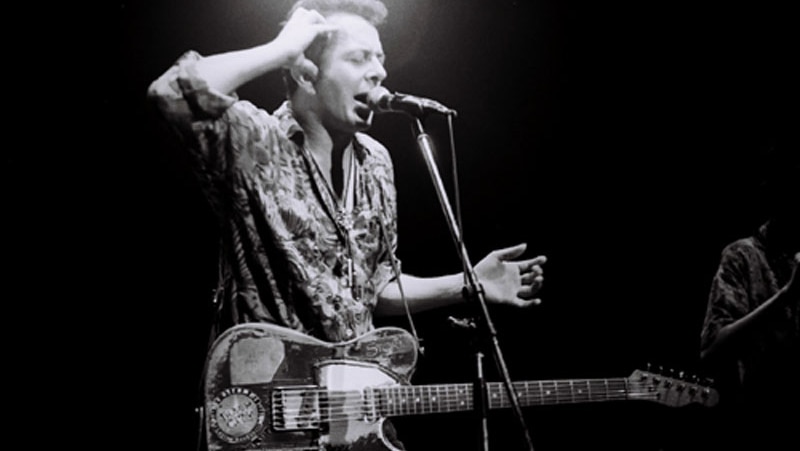 Joe Strummer, backing with the Pogues in Japan in 1992.