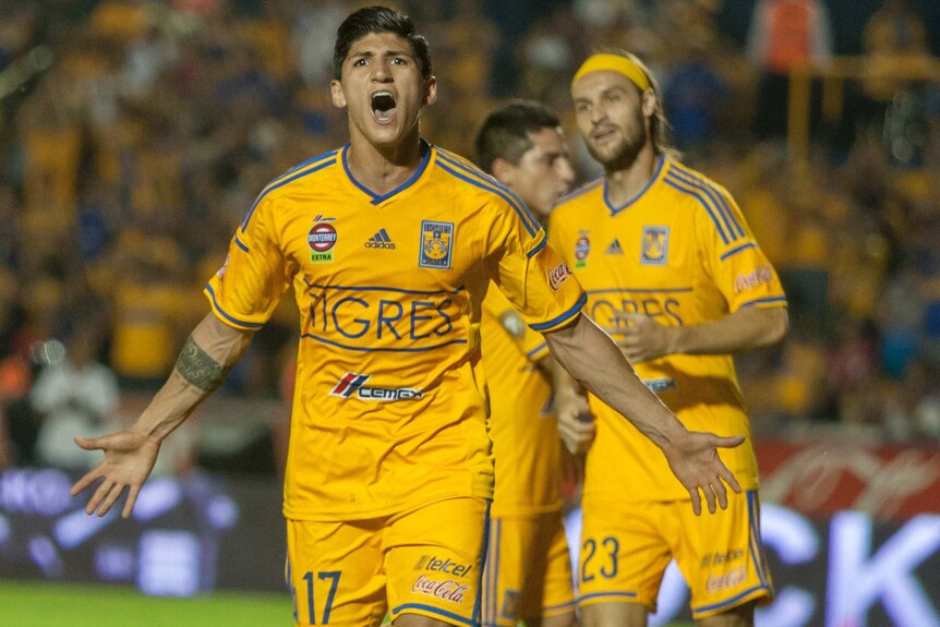 Tigre's Alan Pulido celebrates after scoring against Atlas during the 2014 Mexican Clausura tournament.