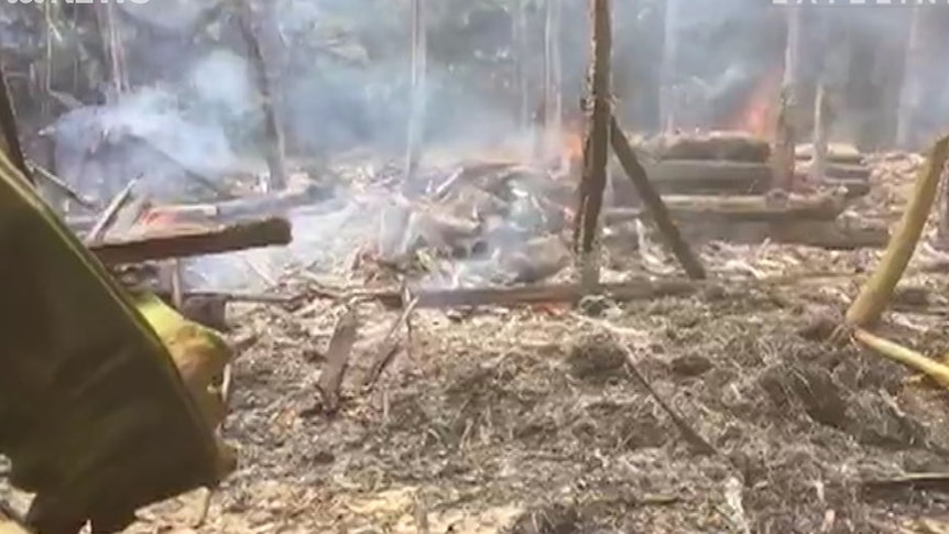Footage filmed by Myanmar local media The Irrawaddy purportedly showing a structure in a Rohingya Muslim village on fire.