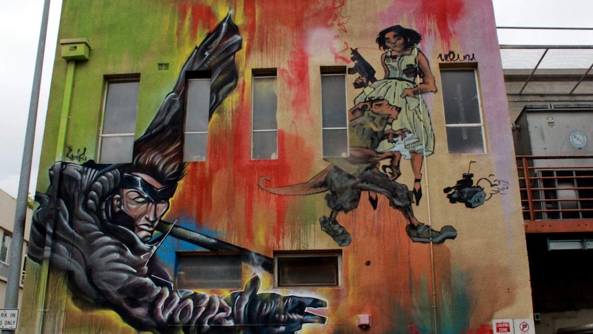 Gambit from the X-Men, by Voir and Tank Girl by Byrd (Dan Maginnity) on a wall in Tocumwal Lane.