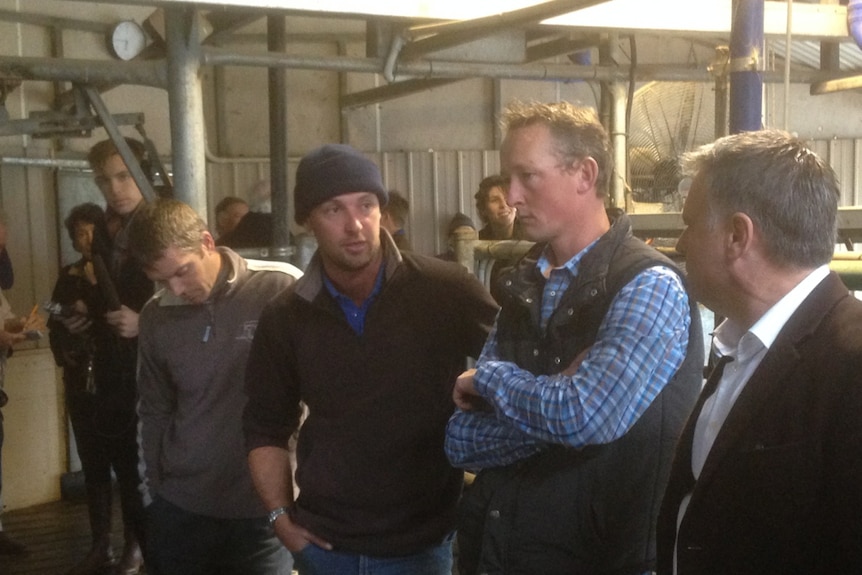 Dairy farmers share their stories with Shadow Agriculture Minister Joel Fitzgibbon during the MP's visit to a farm near Colac.