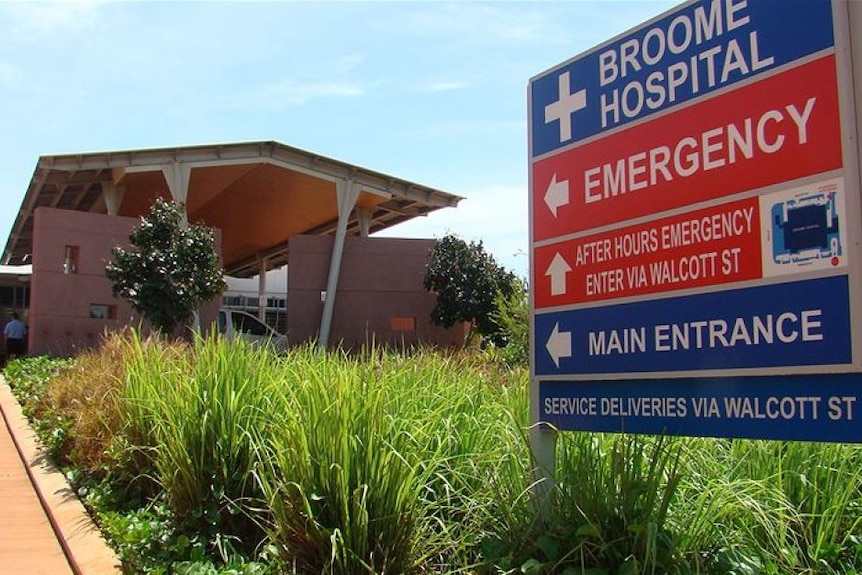 External photo of Broome Hospital, with a sign outside the emergency department.