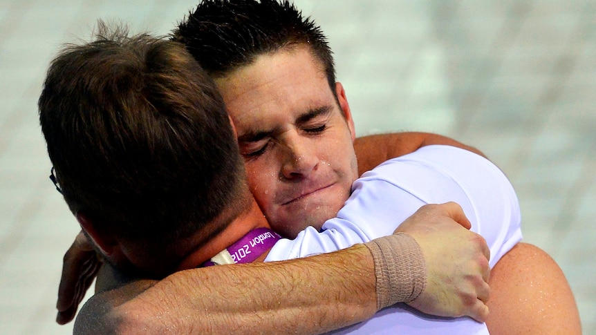David Boudia is hugged after winning the gold medal in the men's 10m platform.