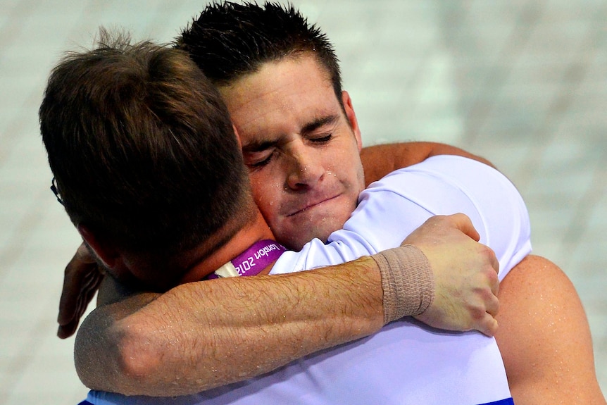 David Boudia is hugged after winning the gold medal in the men's 10m platform.