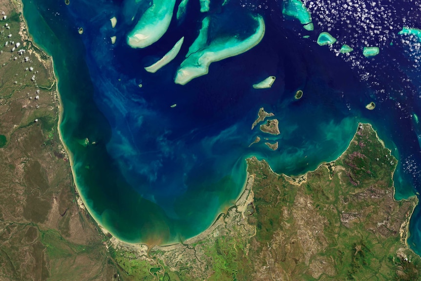 A satellite picture of dirty water running into the reef lagoon.