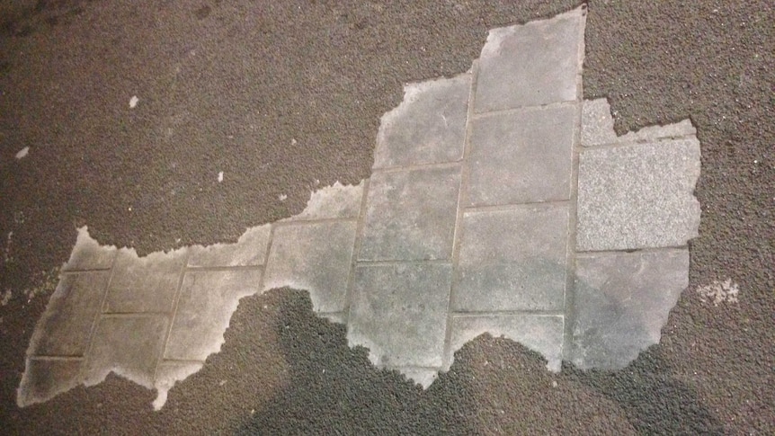 Pavers wearing through the road surface on Hindley Street.