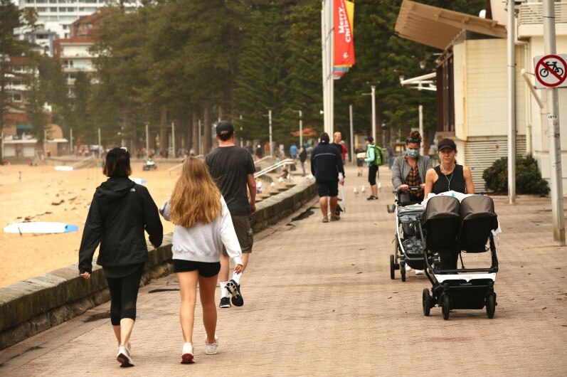 People out exercising in the beach.