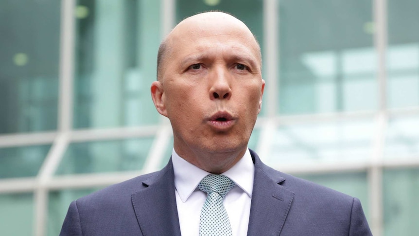 Peter Dutton talks to media outside Parliament