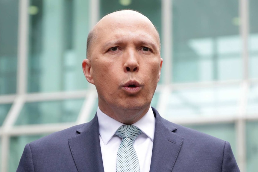 Peter Dutton talks to media outside Parliament