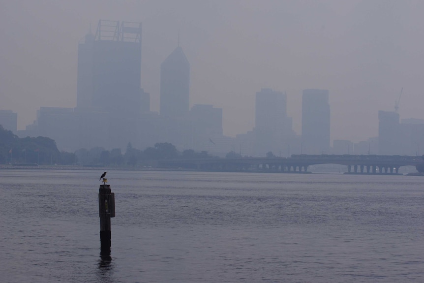 The Perth CBD barely visible from smoke haze.