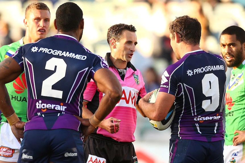 Cameron Smith speaks to referee Gerard Sutton