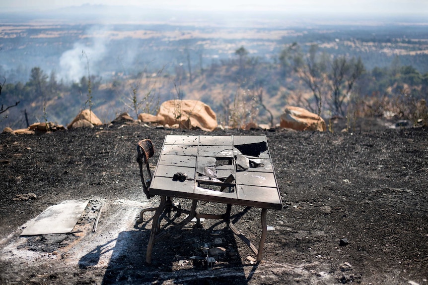 A charred desk rests outside a residence after a wildfire near Oroville, California.
