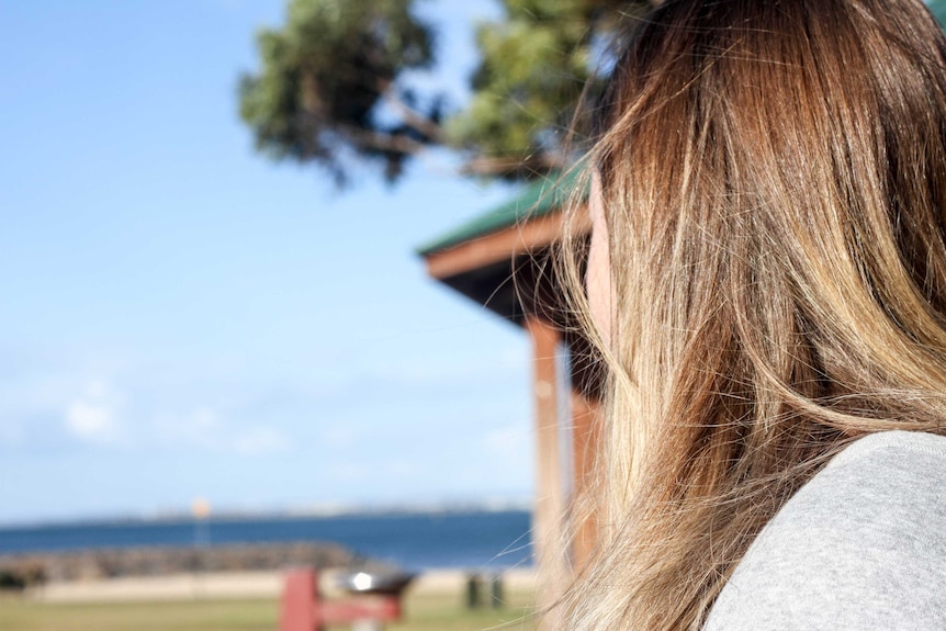 Girl looking out to the ocean.