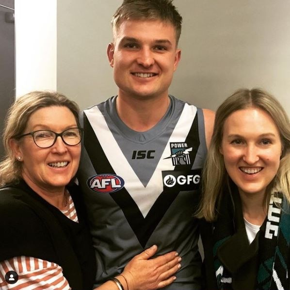 Ollie Wines with his mother and sister