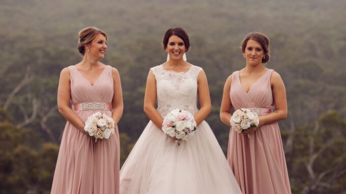 An unknown bride and two bridesmaids