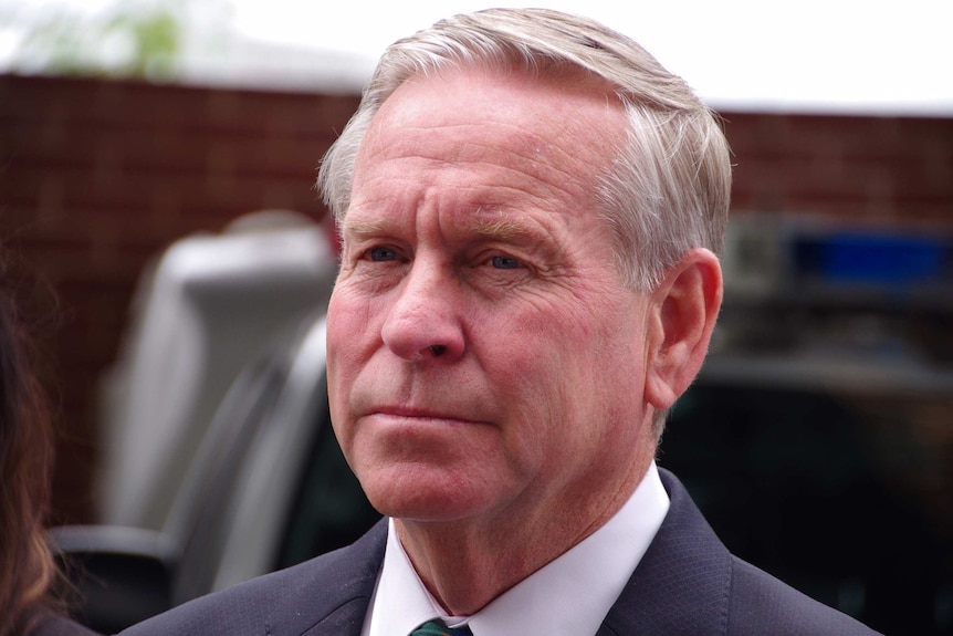 A head shot of Colin Barnett outdoors.