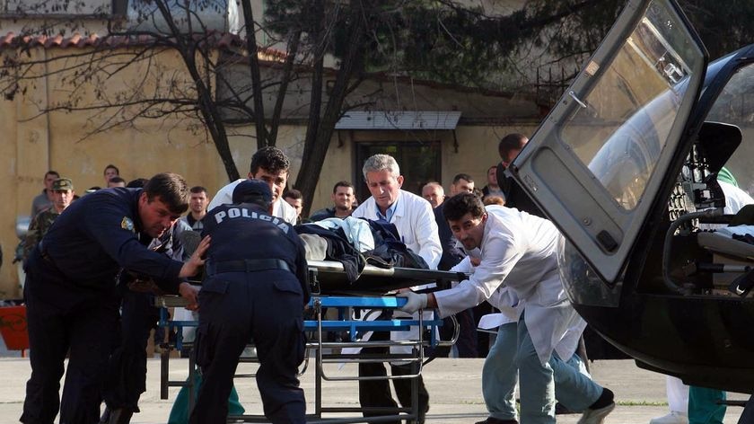 Man wheeled into hospital after Albanian blast