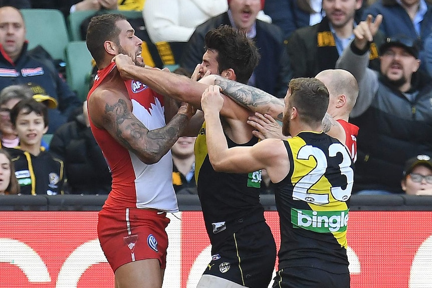 Lance Franklin and Alex Rance square up