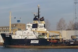 A boat with the Svitzer logo on the side.
