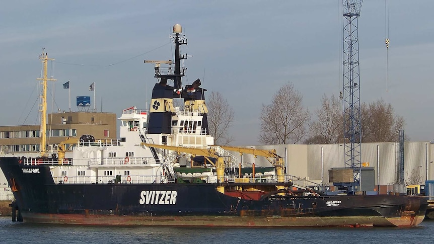 A boat with the Svitzer logo on the side.