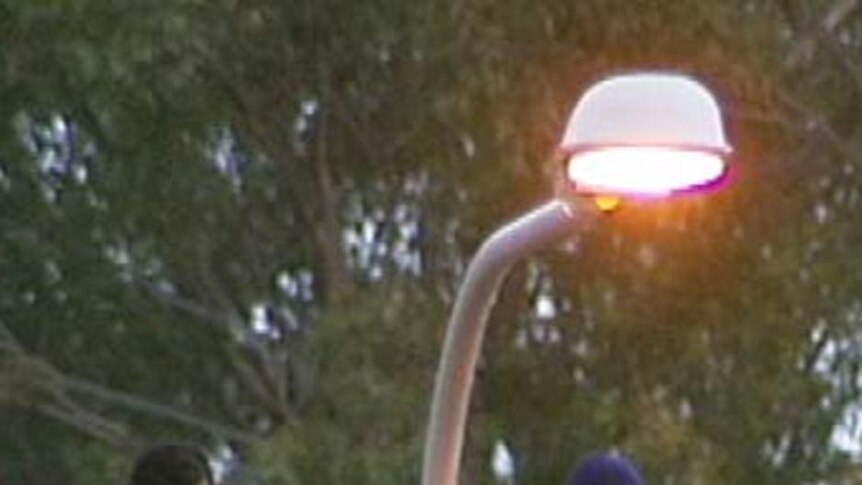 Asylum seekers on the roof of a building at Villawood