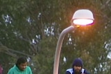 Asylum seekers on the roof of a building at Villawood