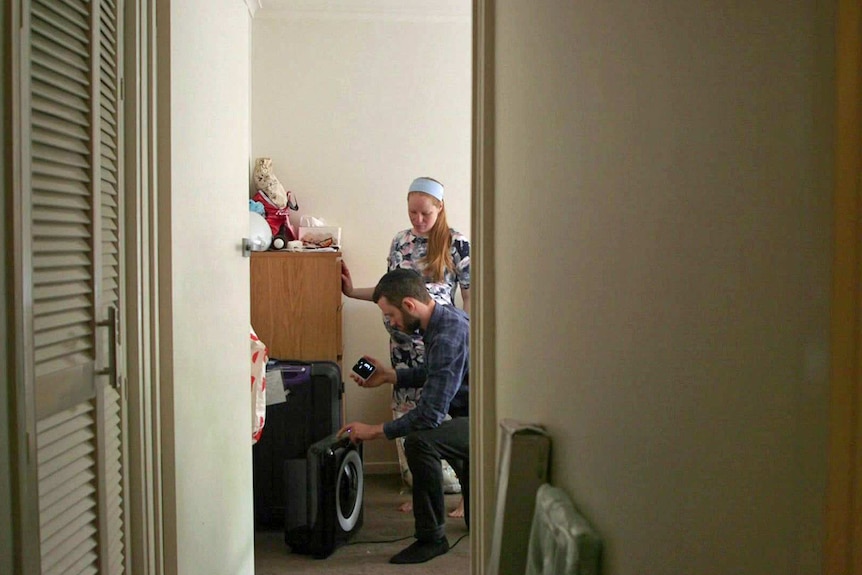 Rachael Neumann and Shalev Nessaiver in a bedroom.