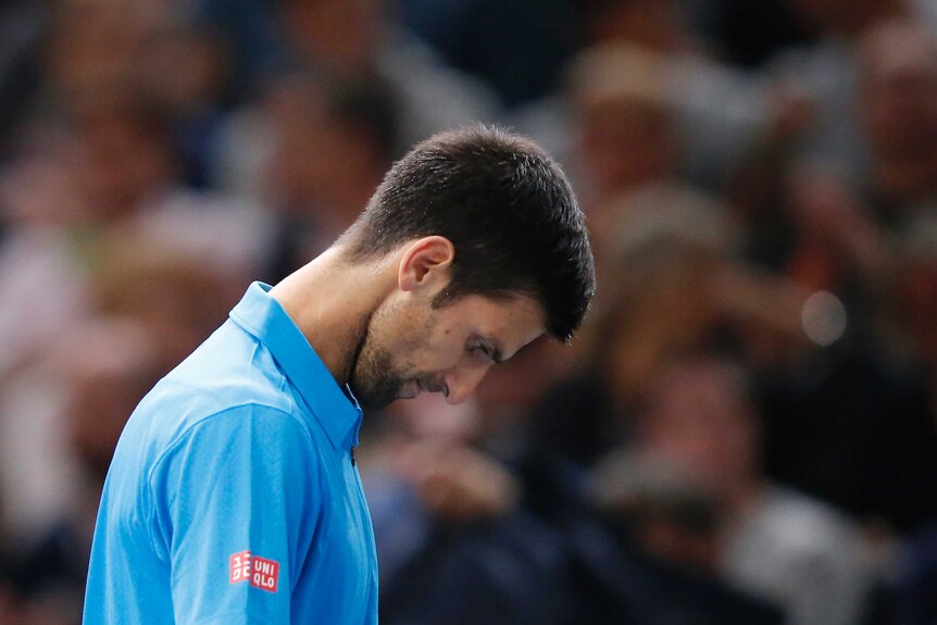 Serbia's Novak Djokovic reacts after losing a point against Marin Cilic at the Paris Masters.
