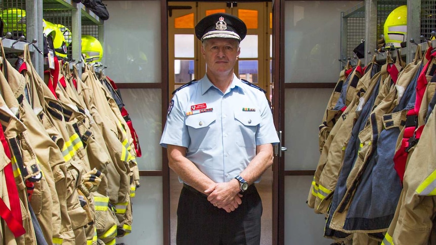 FRNSW Commissioner Greg Mullins surrounded by firefighting gear