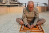 Nepalese mountain climber Min Bahadur Sherchan, does his morning Yoga at his residence in Kathmandu.