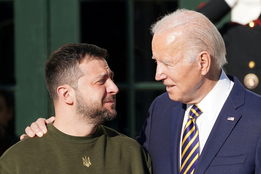 Head shots of Volodymyr Zelenskyy  and Joe Biden with Joe's hand on Volodymyr's shoulder