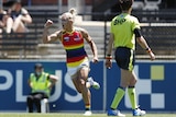Erin Phillips celebrates a goal during the 2022 AFLW pride round