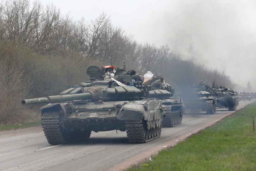 Three tanks riving a long a road. 