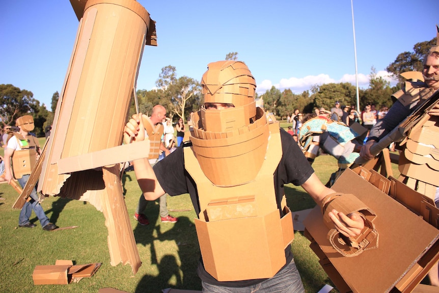 Liam McLaughlin dons a cardboard helmet as destruction gets underway.