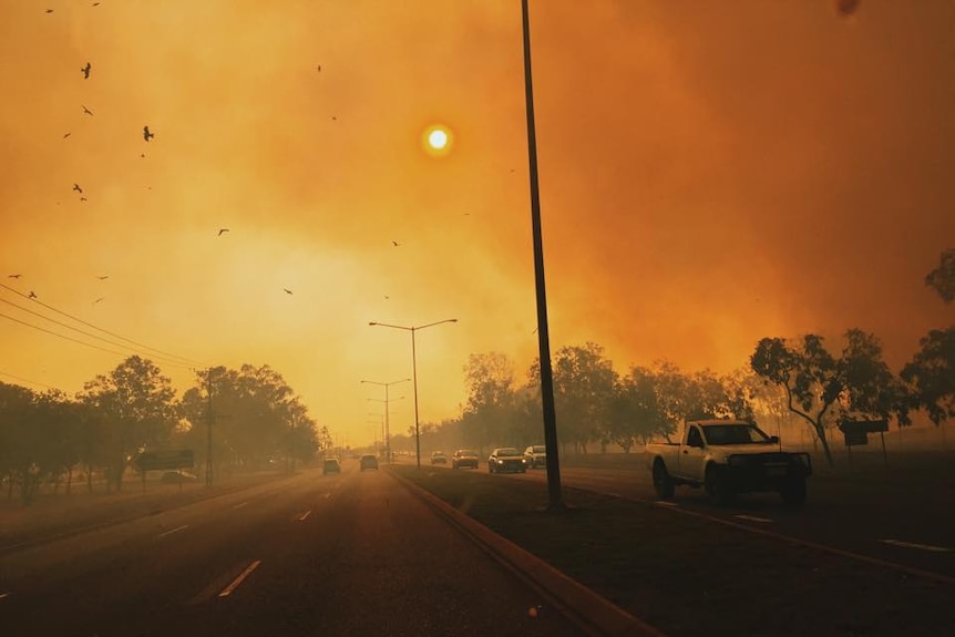 Inferno flames sideline the Stuart Highway in Darwin