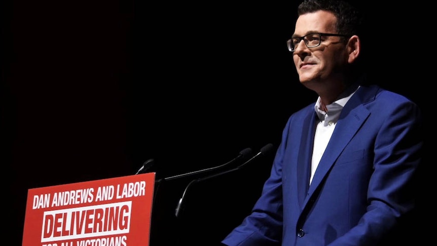 Daniel Andrews smiling at a podium at the election launch.