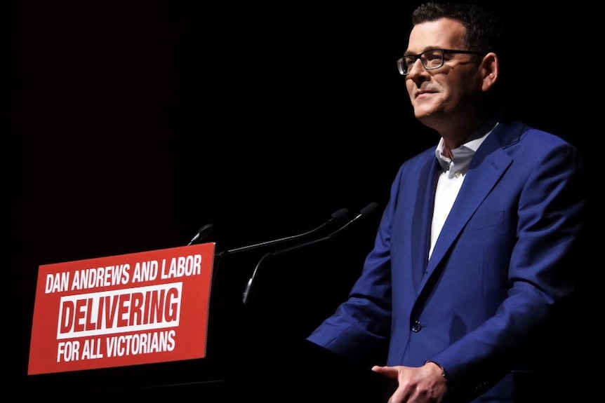 Daniel Andrews smiling at a podium at the election launch.