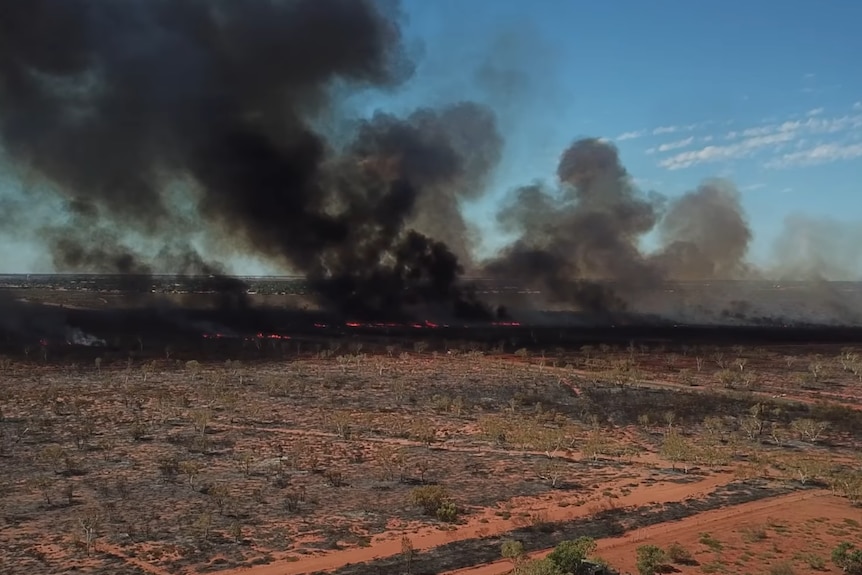 A drone shot of a bushfire.