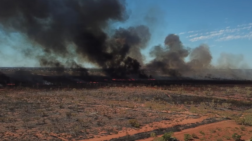 A drone shot of a bushfire.