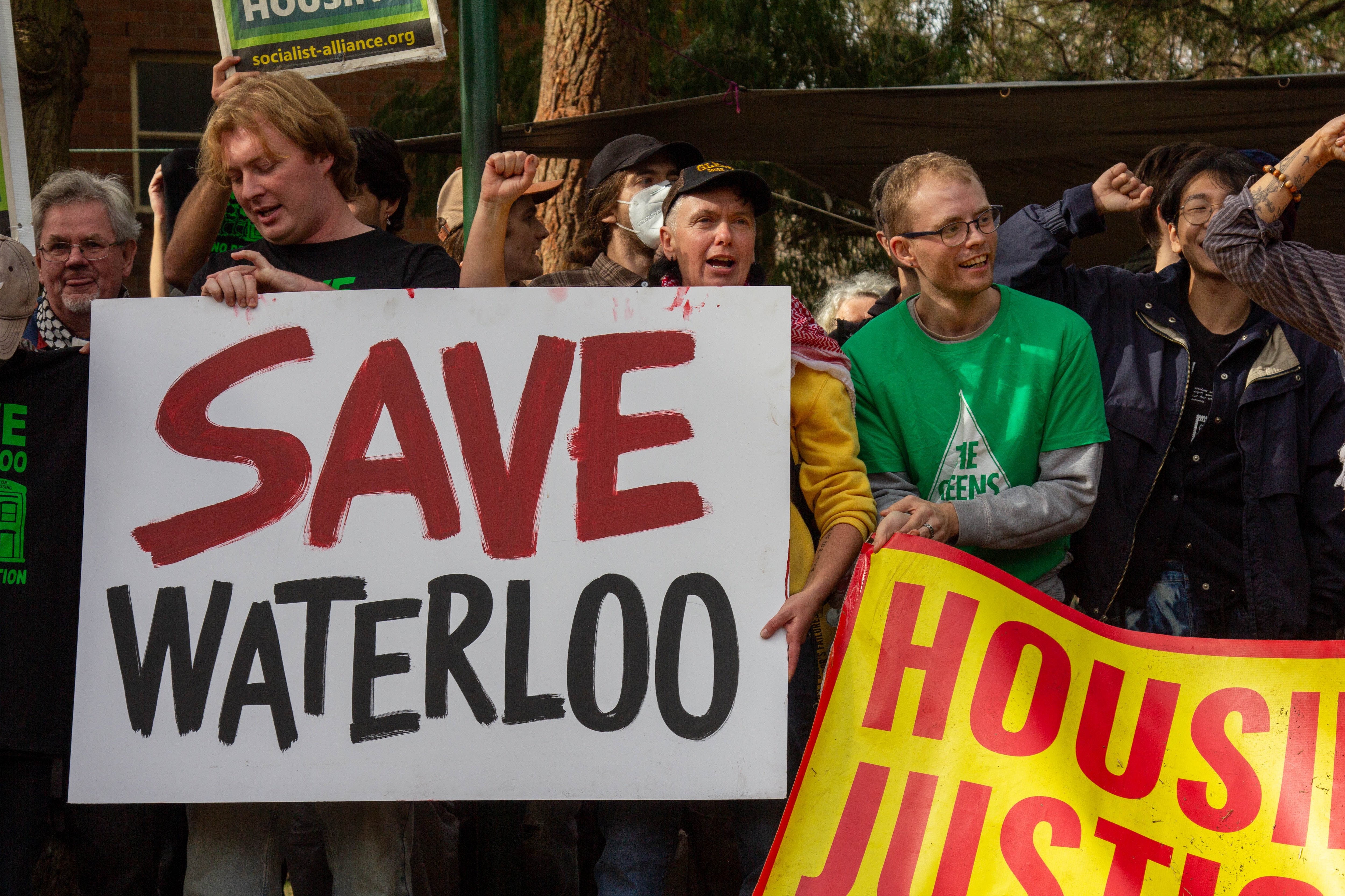 A group of people with signs reading "Save Waterloo".