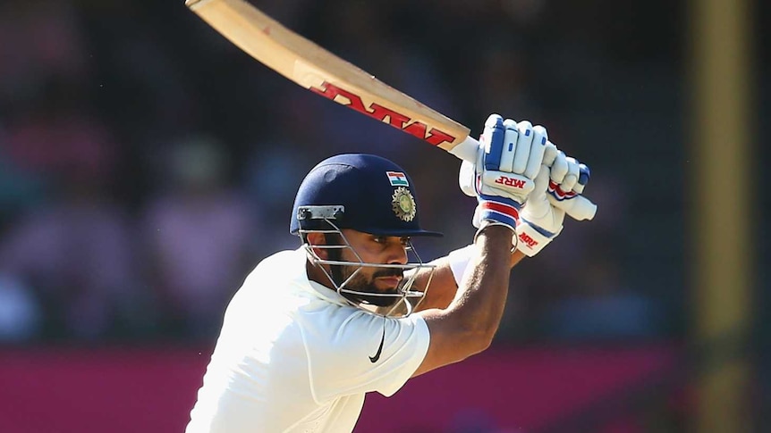 Virat Kohli drives on day three at the SCG