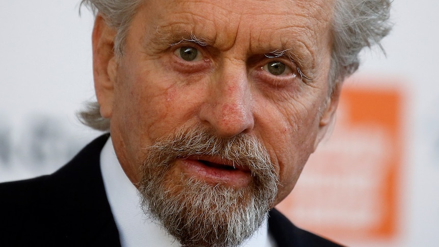 A close-up of actor Michael Douglas looking intensely into the camera.