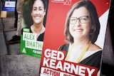 One sign for Labor candidate Ged Kearney next to a sign for Greens candidate Alex Bhathal
